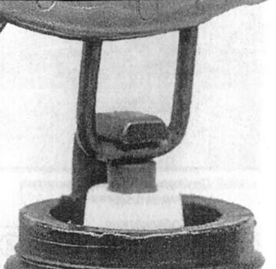 22.10a. Checking the interelectrode gap size using a wire-type gauge