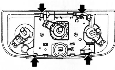11.18. The arrows indicate the latches of the switch block of the HVAC control panel
