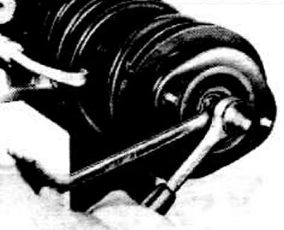 Place the thrust bearing on the shock absorber rod. Position the flat cup -A- with the edges facing…