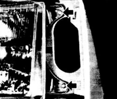 Unscrew the headlight mounting screws from the engine compartment.