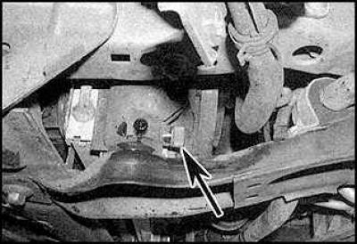 8. Remove the engine undershield if necessary and install a coolant collection container.