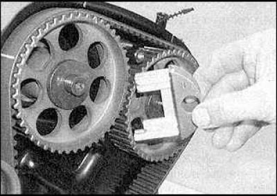 5. Lock the camshafts, tool KM-800-1 (marking 1 and 2, red handle) is designed for the shafts of…