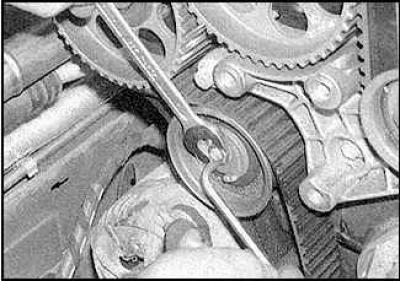 7. Loosen the timing belt tensioner pulley nut.