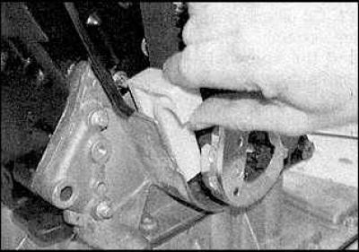 4. Place the belt on the sprockets. The arrows on the belt should point in the direction of belt…