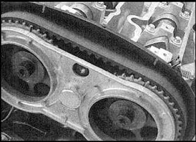 9. Pass the belt over the lower idler pulley.