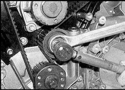 10. Loosen the lower idler pulley bolt. Turn the pulley counterclockwise to tighten the left side…