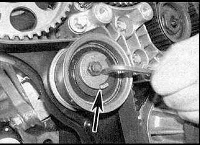 12. Loosen the upper idler pulley bolt. Turn the pulley counterclockwise to tighten the upper…