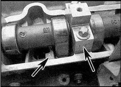 2. Remove the camshaft sprockets. If you are removing the camshafts from the right cylinder head,…