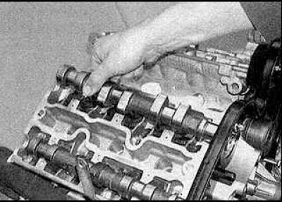 1. Lubricate the tappets and tappet bores with clean engine oil and install the tappets in their…