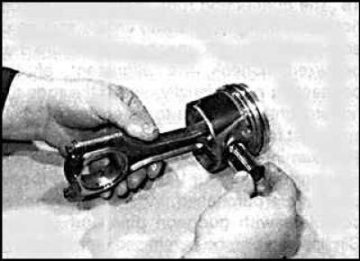 15. Assemble the piston and connecting rod so that the arrow on the piston head points in the…