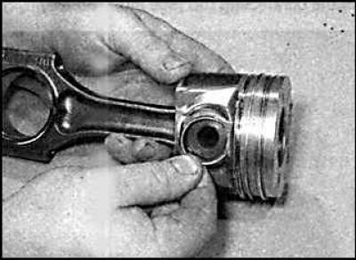 16. Lubricate the piston pin and insert it into the piston and connecting rod upper head. Check…