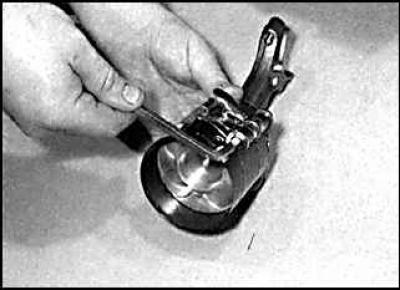 2. Lubricate the pistons and piston rings with clean engine oil and position the piston ring gaps…
