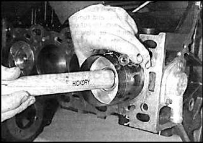 3. The installation of pistons should begin with the first cylinder. Compress the piston rings on…