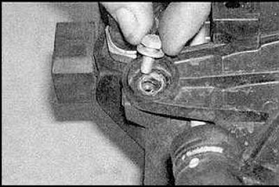6. Remove the auxiliary water pump located on the side of the fan shroud.