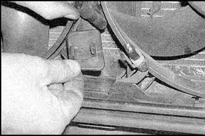 3. Remove the screws and detach the air intake from the crossmember.