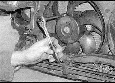 5. Disconnect the wiring harness channel from the body.
