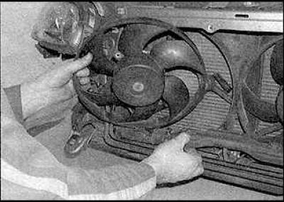 5. Disconnect the wiring harness channel from the body.