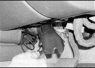 3. Release the retaining clips and remove the trim panel.
