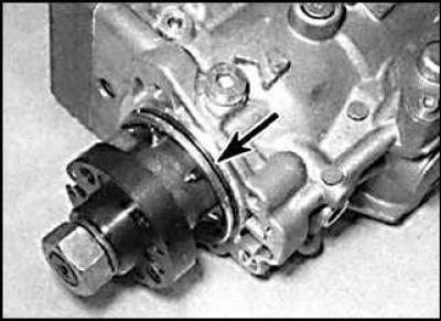 5. Unscrew the bolts (indicated by arrows) and remove the mounting bracket from the rear of the…