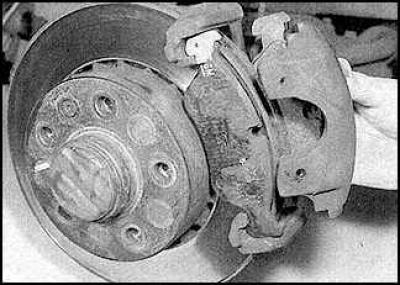 6. Loosen and remove the caliper finger bolts.