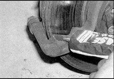 3. Lubricate the back of the pads with high temperature grease.