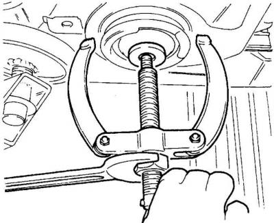 4. Loosen the mounting bolts and remove the crossmember mounting brackets.