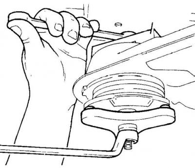 4. Loosen the mounting bolts and remove the crossmember mounting brackets.