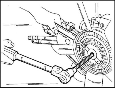 4. Loosen the viscous coupling fan mounting bolt as shown in the illustration. On the reverse side,…