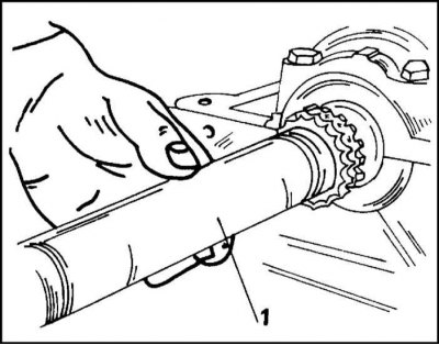 12. Press the sprocket using the pipe (1) as shown in the illustration. onto the crankshaft until…