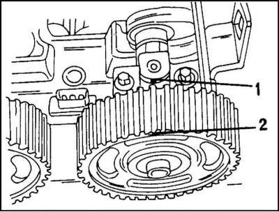 4. Okrenite bregasto vratilo tako da se obje oznake prikazane na ilustraciji poravnaju. Poravnajte…