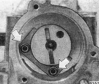 Figure 1.5. Screws securing the camshaft locking plate - shown by arrows.