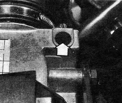 Photo 22.4. Plug (shown by arrow), closing the quality screw.