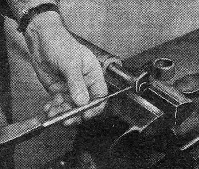 Figure 6.9. Removing the cylindrical pin securing the rod to the intermediate lever