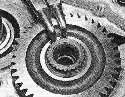 Photo 18.11A. Removing the retaining ring from the end of the drive shaft.