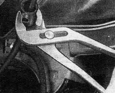 Figure 9.68 - Bend the cable guide retaining tabs