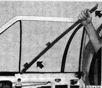 Figure 11.16. Removing the rear door glass holder: Shoot in the direction indicated by the arrows