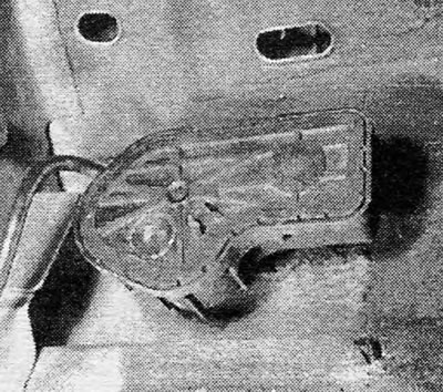 Photo 40.5 Headlight wiper motor. Please note that the motor may be right or left depending on the…