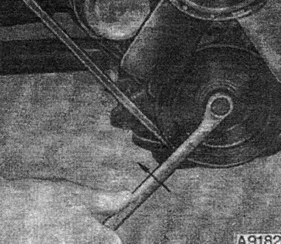 Unscrew the upper and lower timing belt covers.