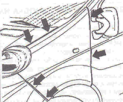 Figure 10.2. The front wing is attached to the body with bolts (arrows).