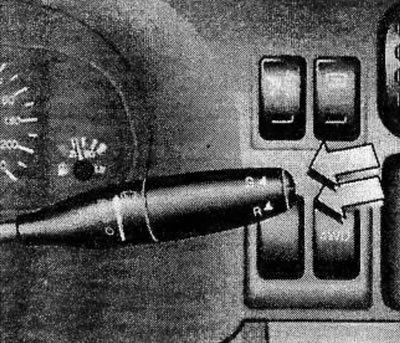 The on-board computer is controlled by two buttons located on the windshield wiper control lever: