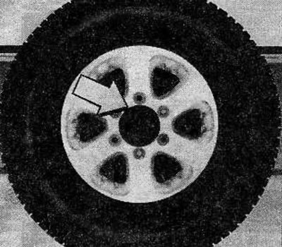 Remove 3 bolts and spare wheel from tailgate.