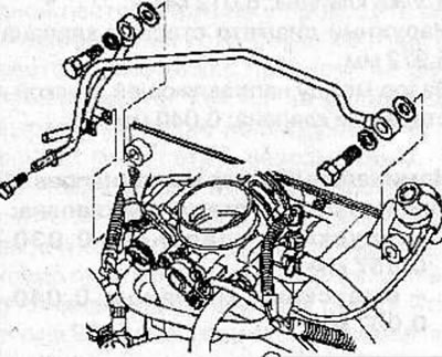 Remove the hollow bolts and disconnect the fuel lines from the fuel rail.