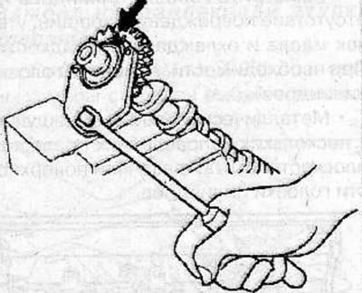 Remove the screws connecting the two sections of the gear.
