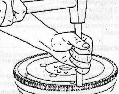 Heat the new flywheel ring gear to 200°C and install it onto the flywheel with the beveled side…
