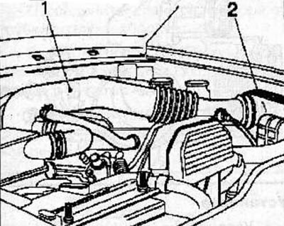 Disconnect the connector from the engine air temperature sensor located on the air intake tube (1).
