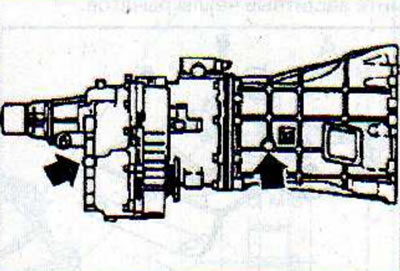 Note: The transmission case and transfer case oil filler plugs (arrows) are located on the right…
