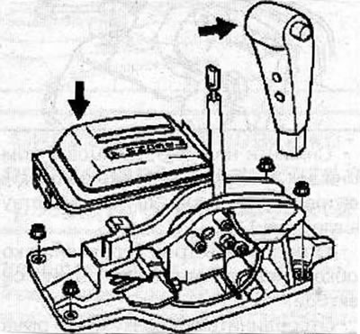 Remove the button from the selector lever and the cover from the base of the selector lever.