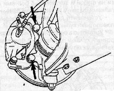 Remove the 2 caliper mounting bolts, lift the caliper up and secure it to the front suspension…