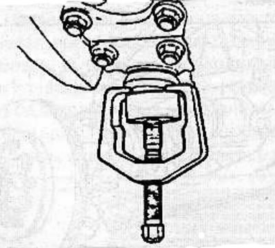 Remove the cotter pin, unscrew the nut and use a suitable puller to remove the lower ball joint…