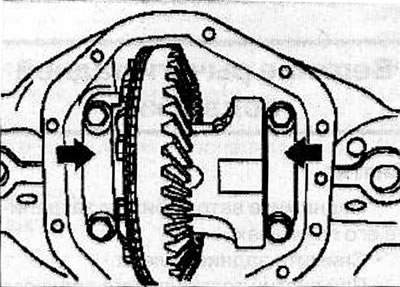 Remove the four bolts and side bearing caps from the rear axle housing. Mark the covers so you know…